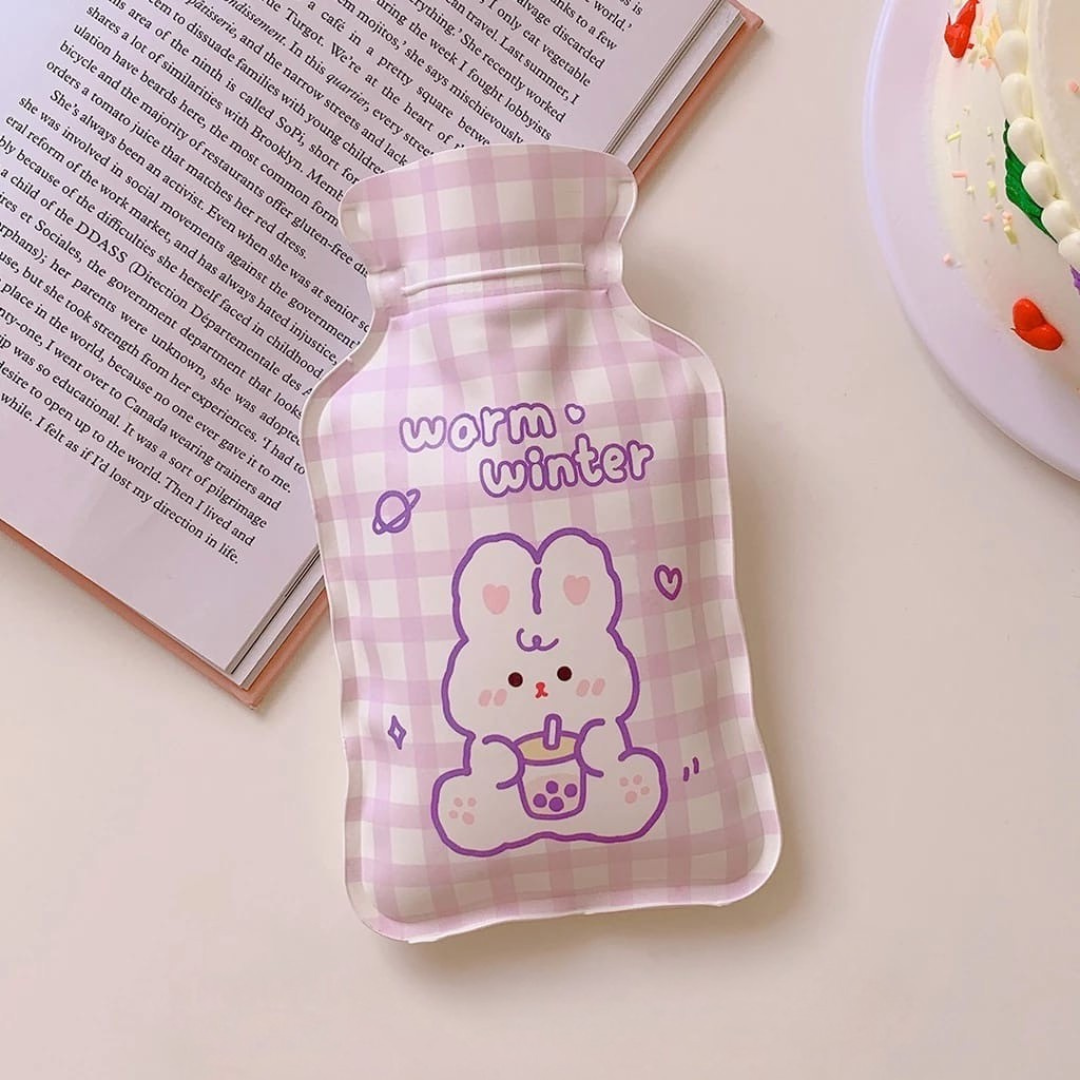 Pink checkered Cute Hot Water Bag with cartoon character and 'warm winter' text on a light surface - Tinyminymo