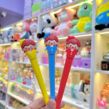 Three Colors of Cute Kawaii Girl Pen held in front of a shelf full of toys and stationery items - Tinyminymo