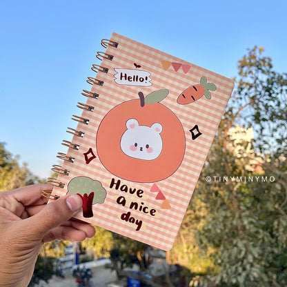 Cute Kawaii Notebook held in a hand - Tinyminymo