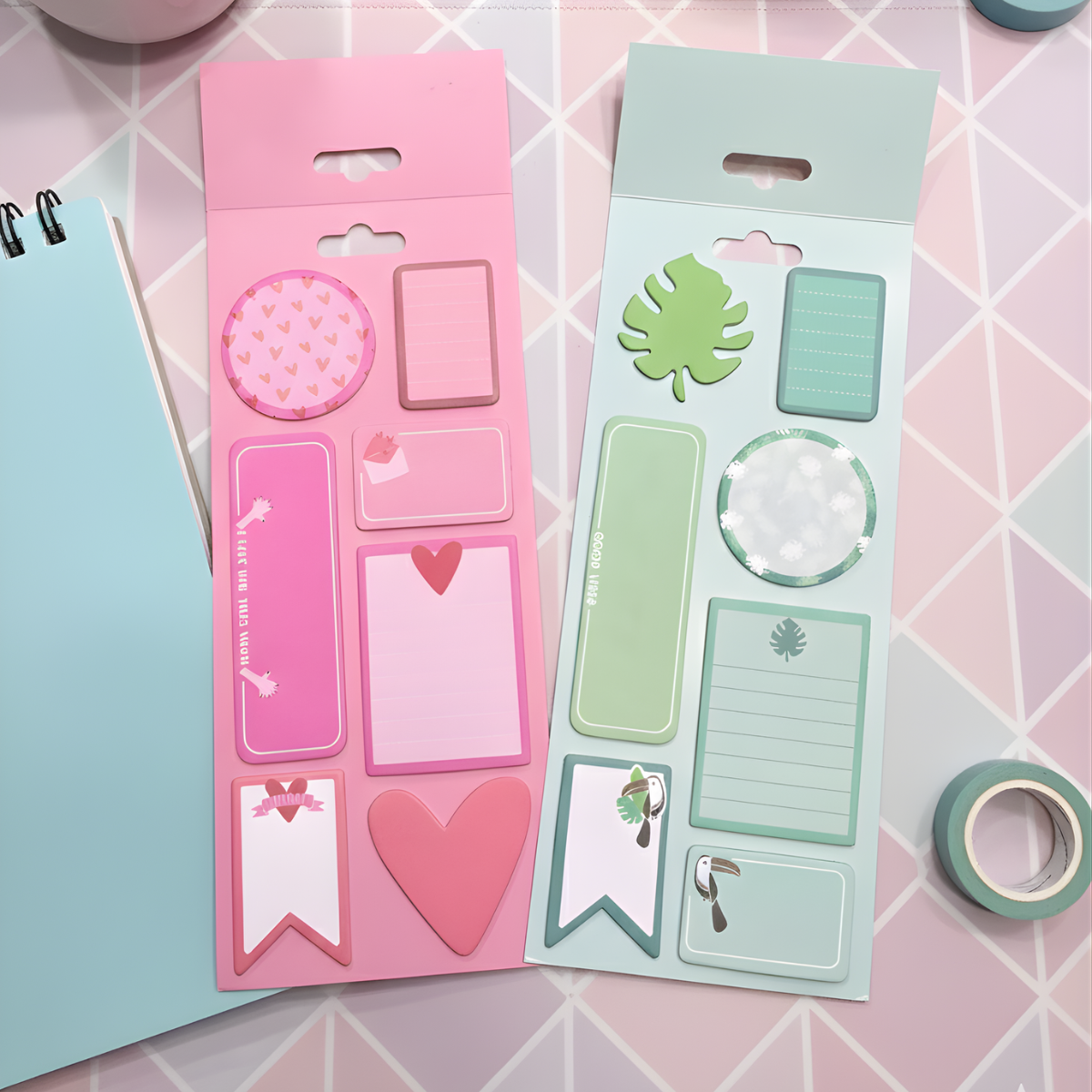 Two packs of decorative sticky notes in Pink and Green on a pink geometric patterned surface - Tinyminymo