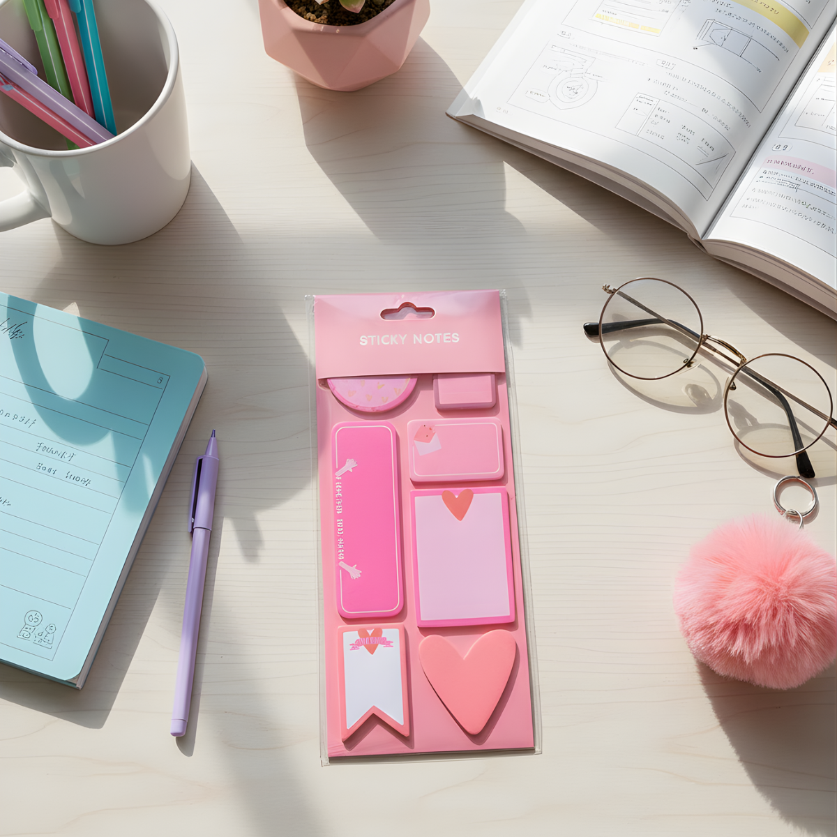 Pink sticky note set on a desk with stationery items - Tinyminymo