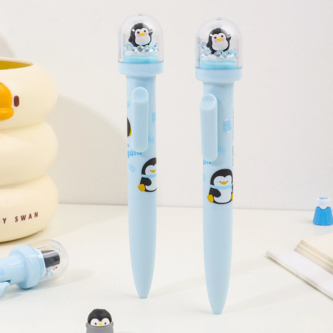 Two Blue Pens with Penguin Designs Displayed on the Table - Tinyminymo