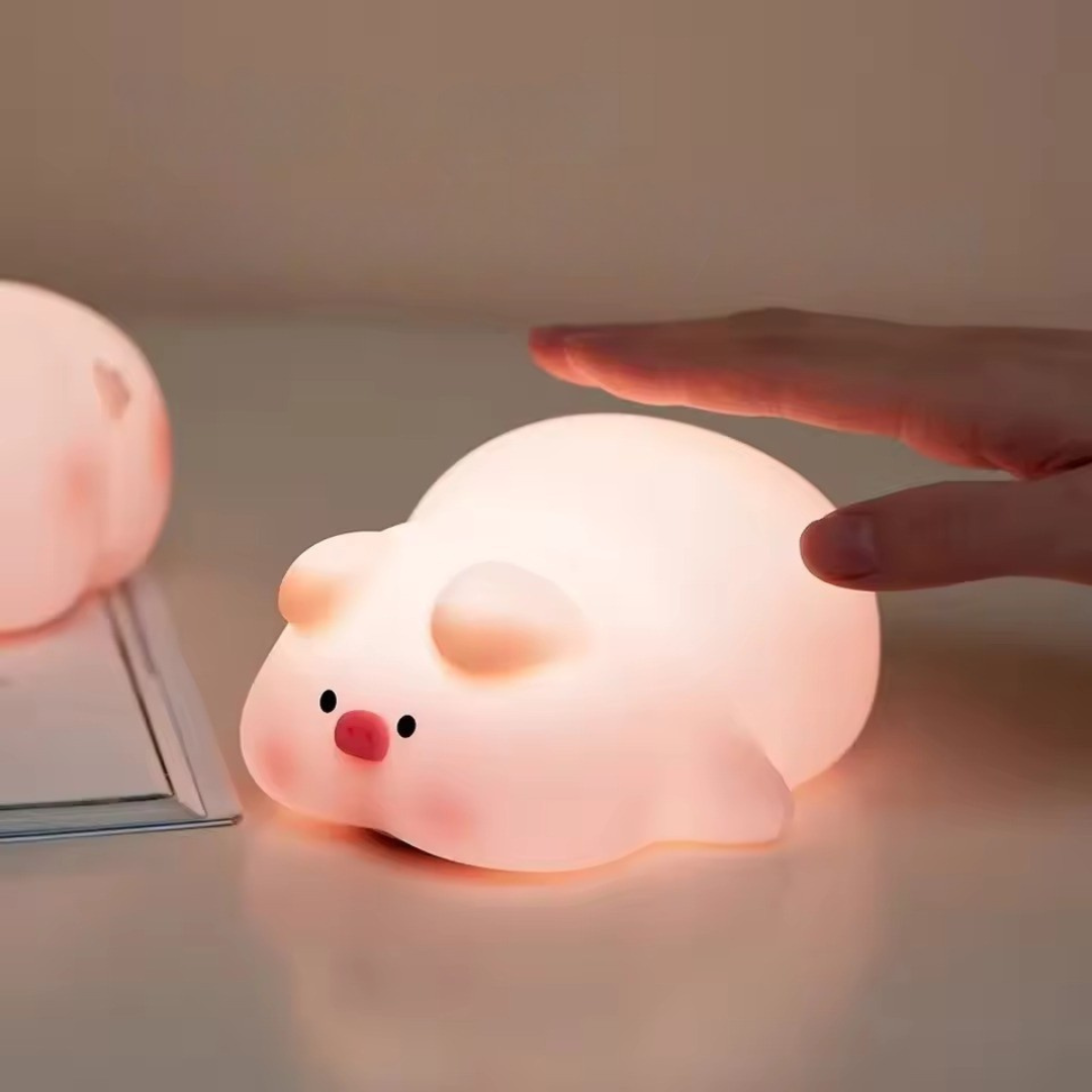 Cute Pig Shaped Night Light being Turned On by a Hand Tap - Tinyminymo