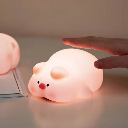 Cute Pig Shaped Night Light being Turned On by a Hand Tap - Tinyminymo