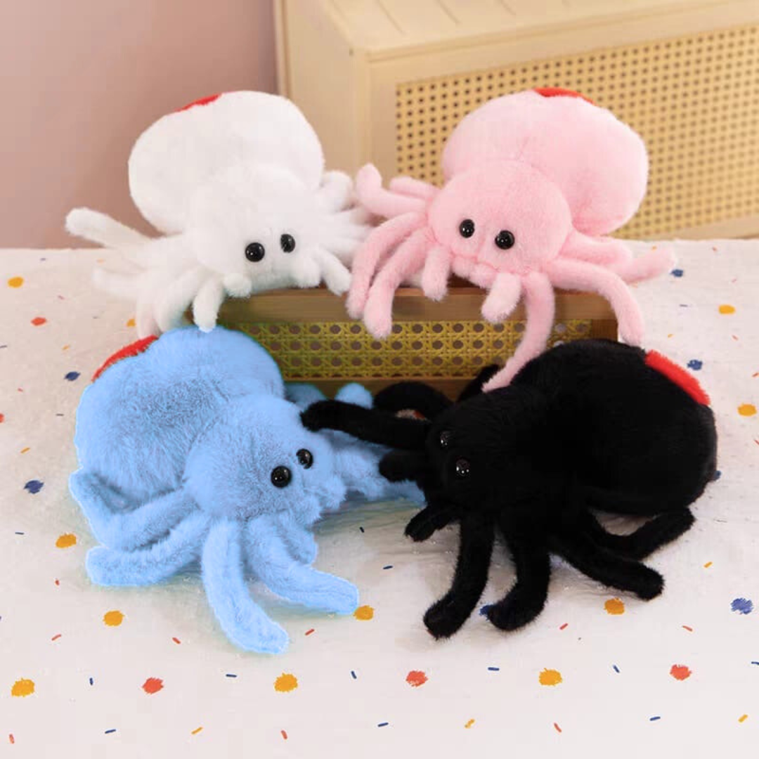 Four Cute Spider Soft Toy in White, Pink, Blue and Black on a colorful surface - Tinyminymo