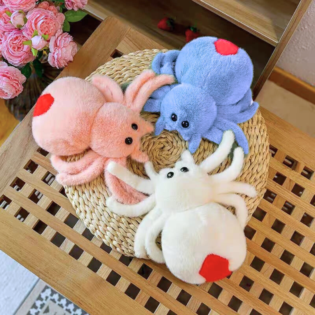 Three Cute Spider Soft Toy on a woven mat with flowers in the background - Tinyminymo