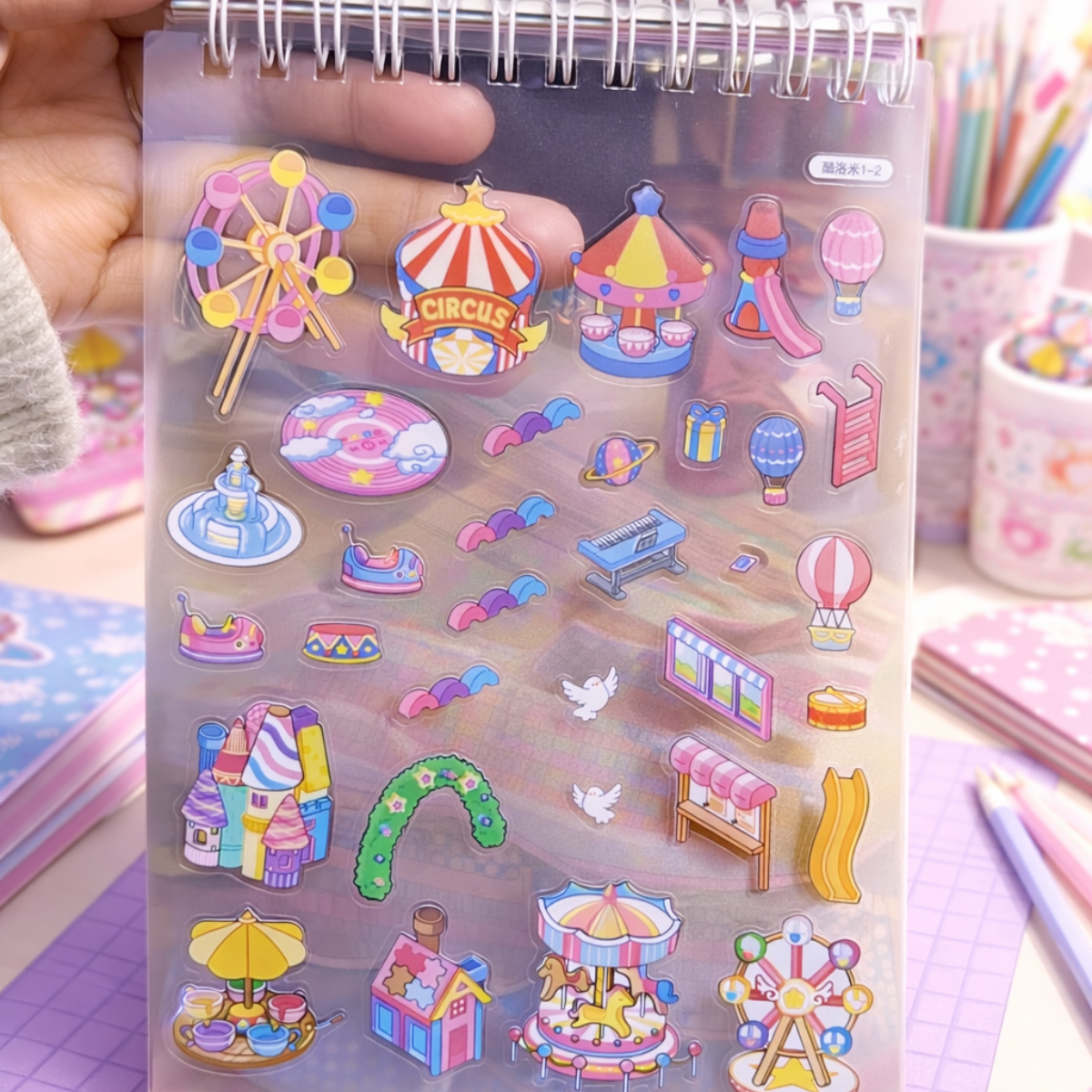 Cute Stickers on a Transparent Sheet Held by a Hand - Tinyminymo