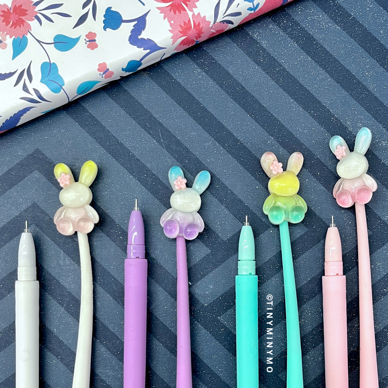 Set of Colorful Dancing Bunny Gel Pens with Bunny-Shaped Tips on a Blue Striped Background - Tinyminymo