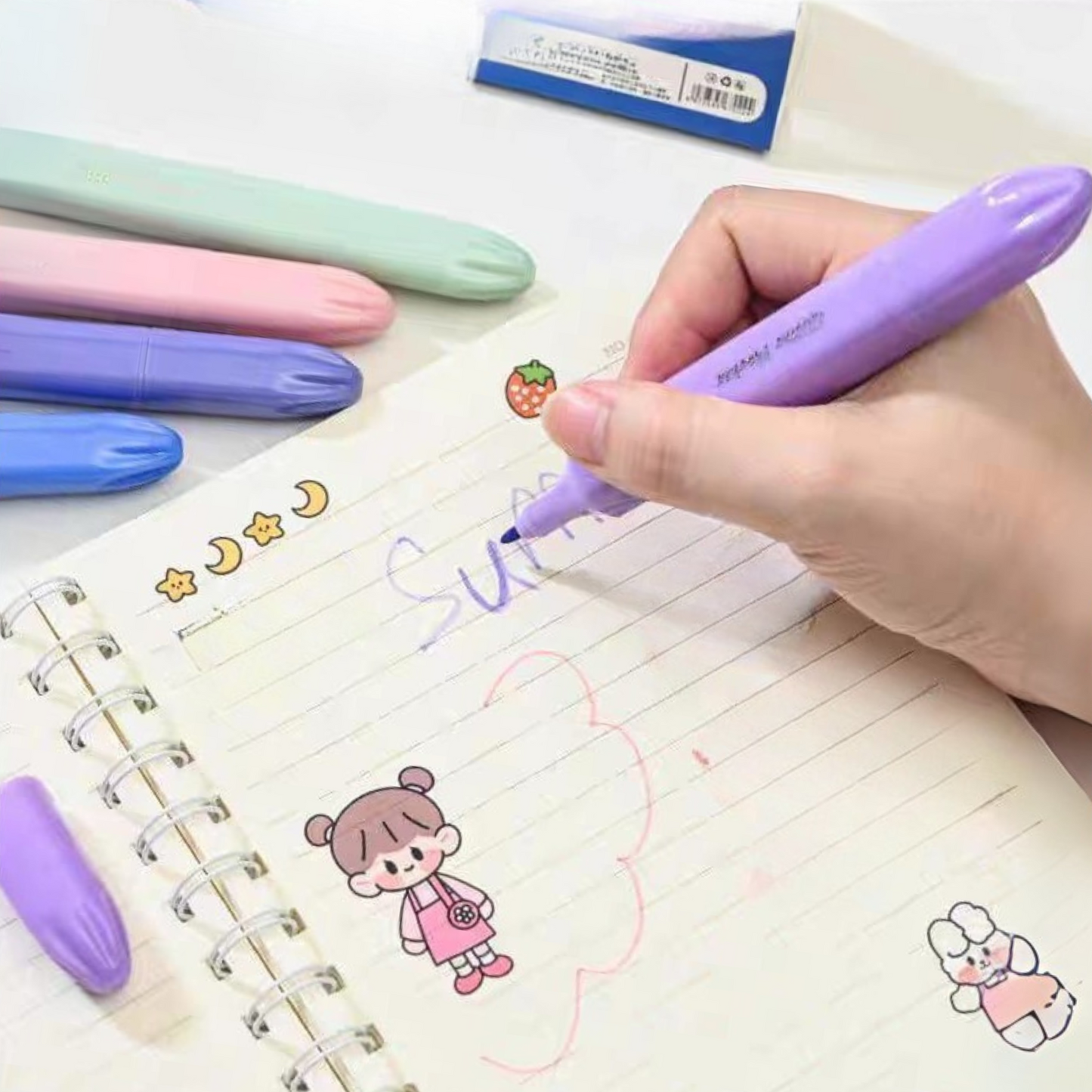 Hand Holding a Dopamine Color Highlighter Writing on a Lined Notebook with Colorful Pens and Stickers in the Background – Tinyminymo
