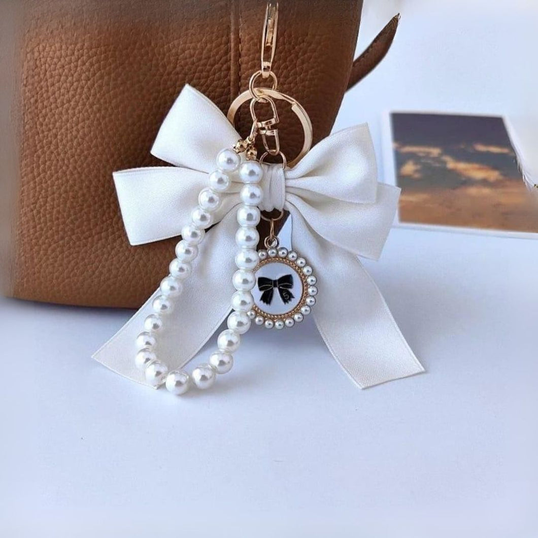 White Bow Mobile Charm Hanging on a Bag - Tinyminymo