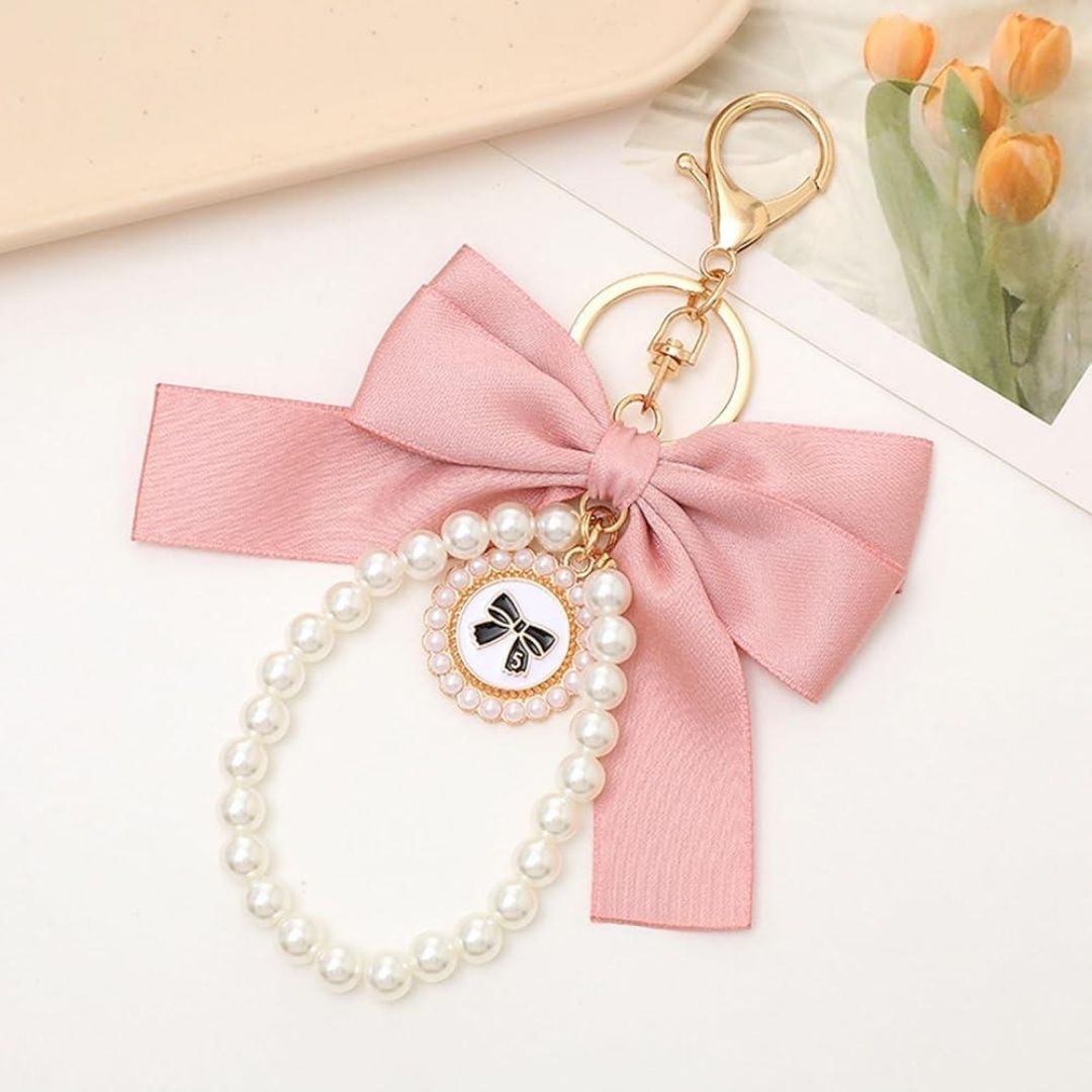 Pink Bow Mobile Charm on a White Surface - Tinyminymo