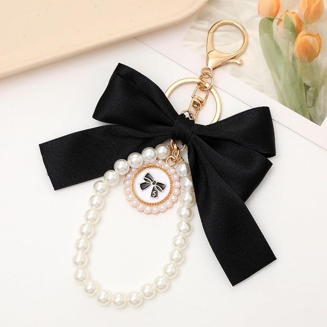 Black Bow Mobile Charm on a White Surface - Tinyminmo