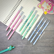 Set of Colorful Erasable Dinosaur Gel Pens on a Wooden Surface with a Notebook - Tinyminymo