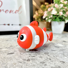 Load image into Gallery viewer, Red Fish 2 in 1 Sharpener and Eraser on a Marble Surface with Flowers in the background - Tinyminymo
