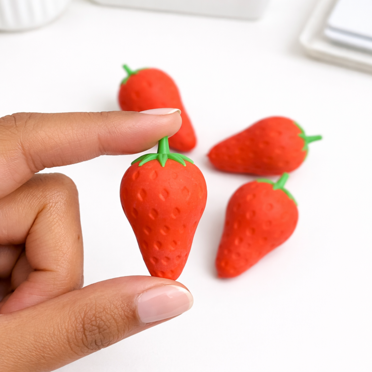 Single Piece Strawberry Eraser held in Hand - Tinyminymo