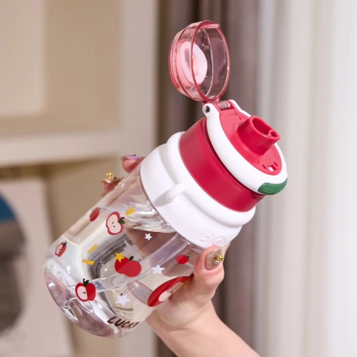 The Bottle is Shown with its Flip Top Lid Open - Tinyminymo