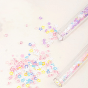 Glitter Confetti Spread Out from Glitter Unicorn Pen on a Paper - Tinyminymo 