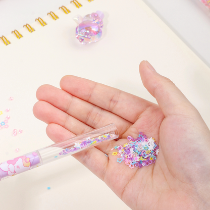 Hand Taking out the Beautiful Glitter Confetti from a  Purple Glitter Unicorn Pen - Tinyminymo