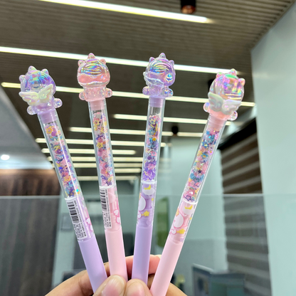 Four Pieces of Glitter Unicorn Pen held in a hand, blurred indoor background - Tinyminymo