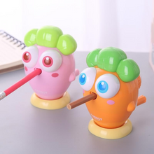 Load image into Gallery viewer, Two Colors of Happy Carrot Mechanical Sharpener Holding a Pencil - Tinyminymo 
