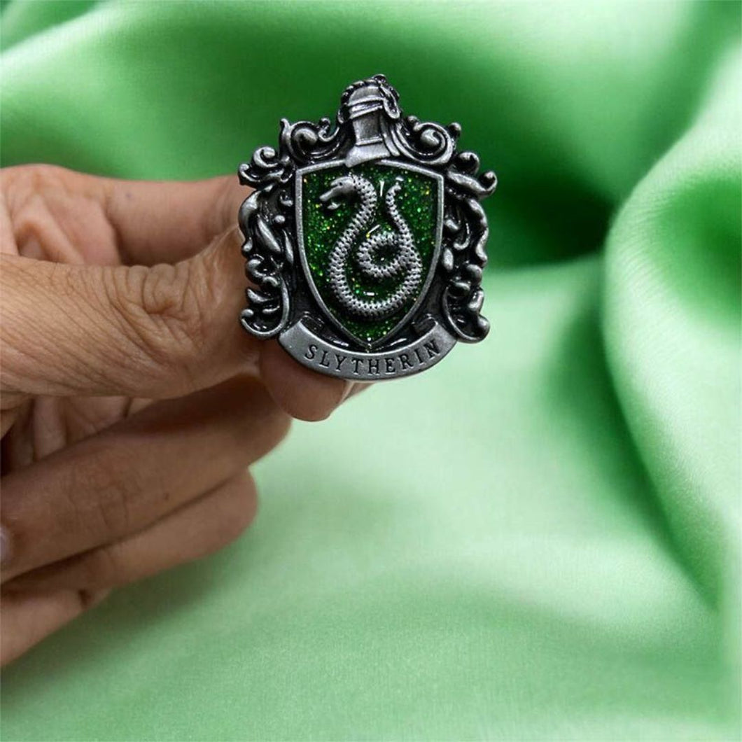 Slytherin Variant of Harry Potter Hogwarts Crest Lapel Pin Held by a Hand - Tinyminymo