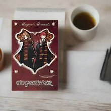 Load image into Gallery viewer, Harry Potter Planner with characters from &#39;Harry Potter&#39; kept on a table with a cup of coffee - Tinyminymo
