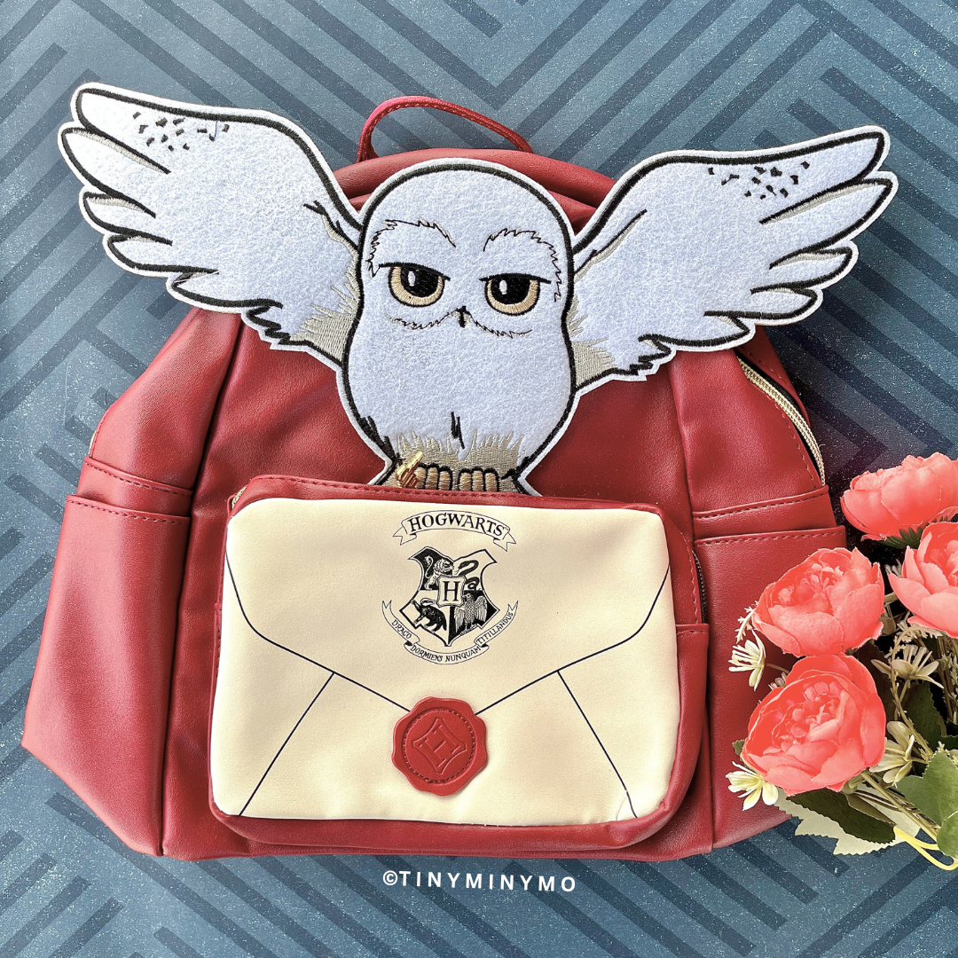 Red Harry Potter's Hedwig Backpack with Owl Design and Hogwarts Letter, Surrounded by Flowers on a Blue Patterned Background – Tinyminymo