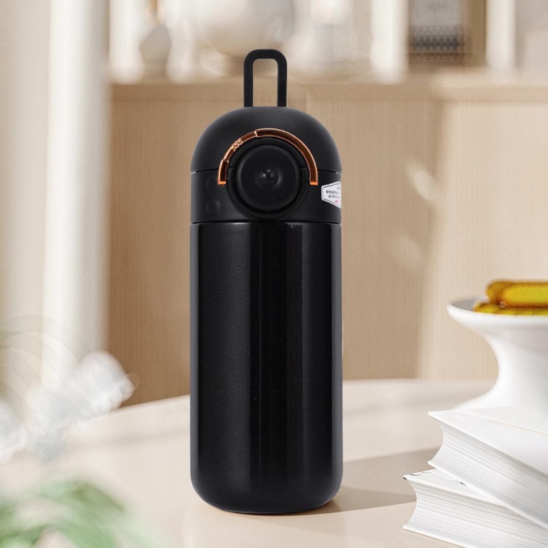 Black Insulated Metallic Travel Bottle on the Study Table - Tinyminymo