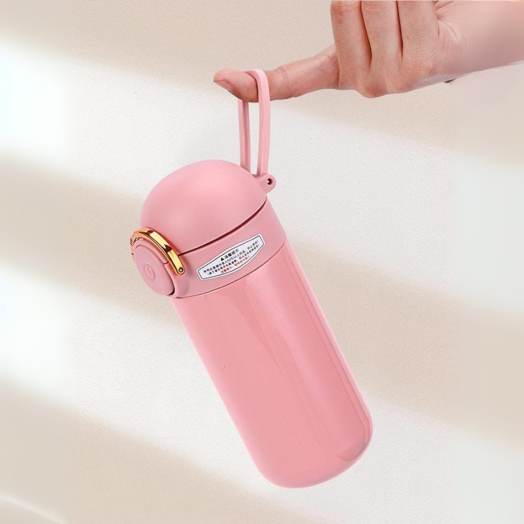 Holding a Insulated Metallic Travel Bottle with Bottle Strap - Tinyminymo