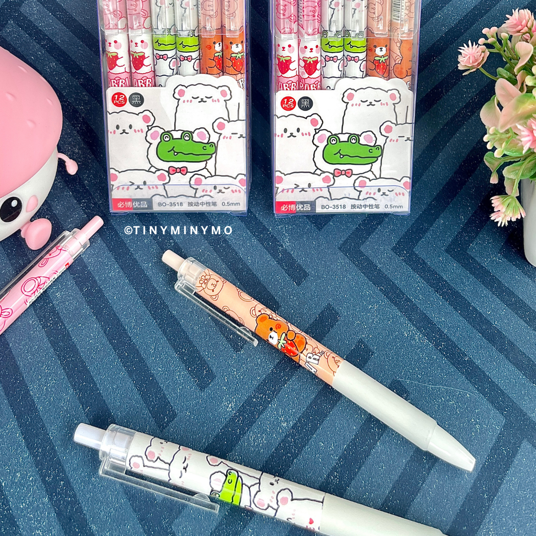Kawaii Animal Gel Pens and Two Sets of Kawaii Animal Gel Pens on a Blue Textured Surface with Flowers - Tinyminymo