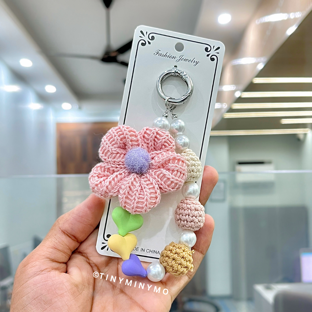 Hand Holding a Pink Crochet Flower with Beads Mobile Charm - Tinyminymo