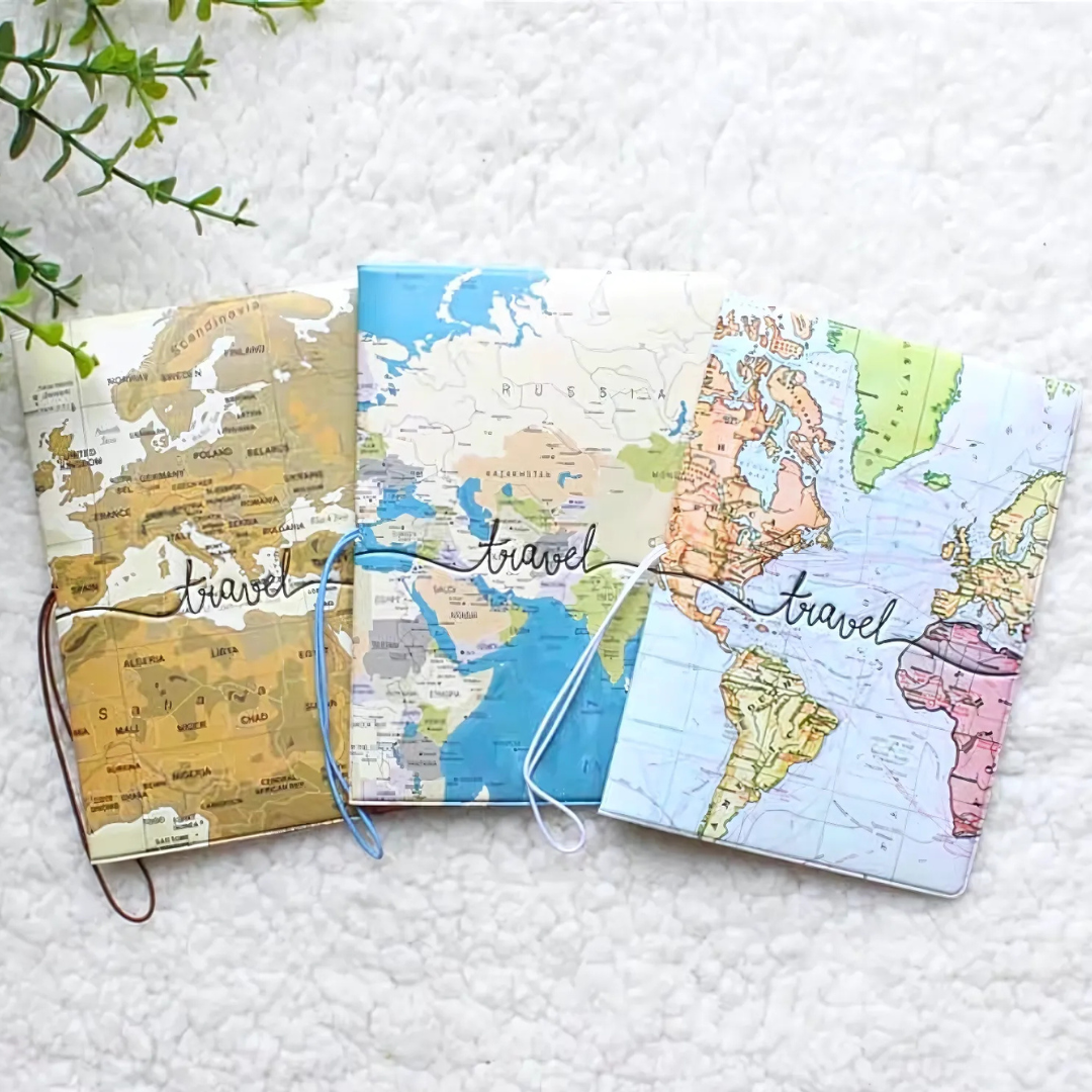 Set of Three Kawaii Passport Covers with World Map Designs Displayed on a Textured Surface - Tinyminymo