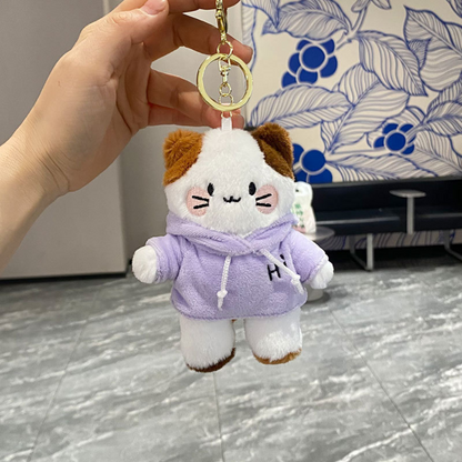 A Hand Holding a Kitty in Hoodie Plush Keychain Wearing a Purple Hoodie - Tinyminymo