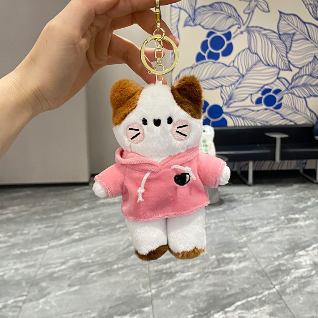 A Hand Holding a Kitty in Hoodie Plush Keychain Wearing a Pink Hoodie - Tinyminymo