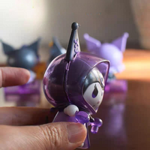 Load image into Gallery viewer, Kuromi Action Figure Held by a Hand Against a Blurred Background - Tinyminymo
