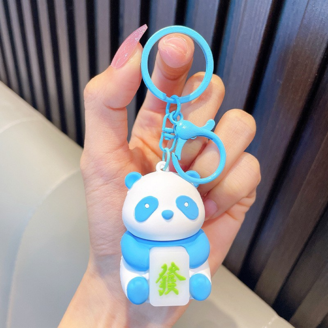 Hand Holding a Blue Panda Keychain - Tinyminymo