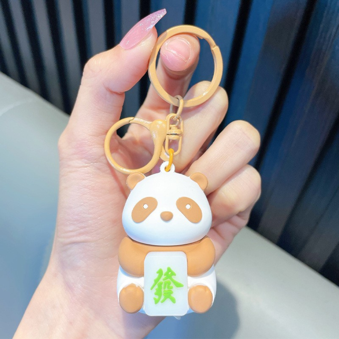 Hand Holding a Brown Panda Keychain - Tinyminymo