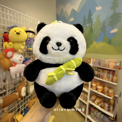Little Panda Soft Toy Held in Front of Store Background - Tinyminymo