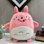 Pink plush Totoro Soft Toy with a happy expression on a surface with a neutral background - Tinyminymo