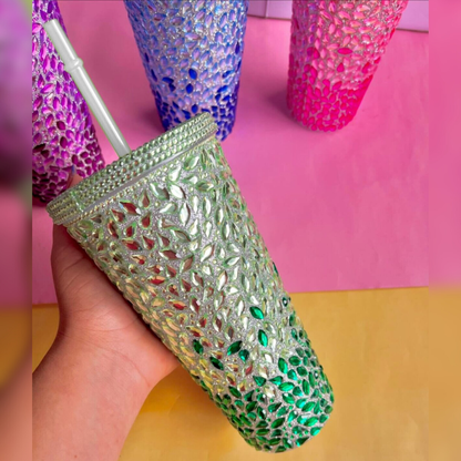 Decorative Green Tumbler with Rhinestone embellishments held by a hand against a colorful background - Tinyminymo