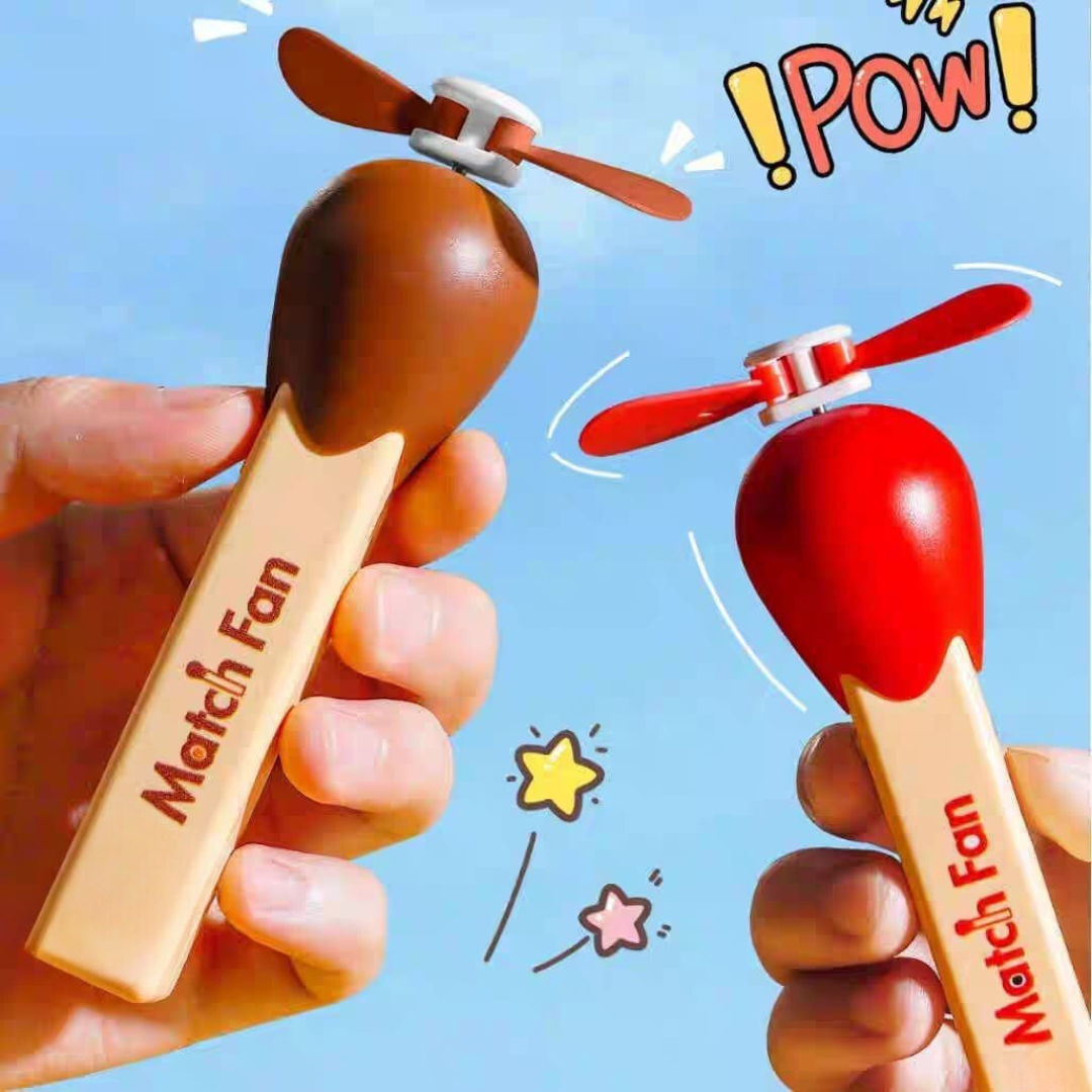Two Match Stick Fans with Propellers, One Brown and one Red, Held by Hands Against Sky in Background with Cartoon Elements - TInyminymo