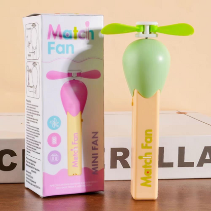 Green Match Stick Fan with Packaging on a Wooden Surface - Tinyminymo