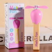 Pink Match Stick Hand Fan with Packaging on a Wooden Surface.- Tinyminymo