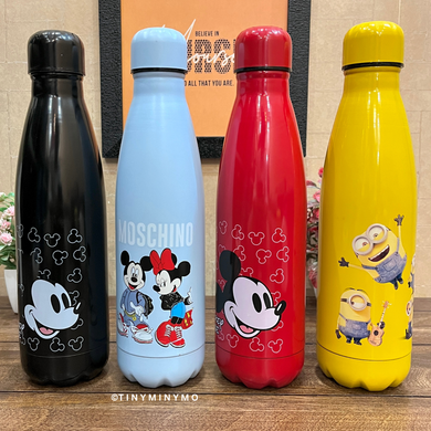 Set of Four Colorful Metallic Water Bottles with Cartoon Designs Placed on a Wooden Surface - Tinyminymo