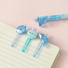 Load image into Gallery viewer, Three Different Designs of Ocean World Gel Pen Clipped to a Notebook - Tinyminymo
