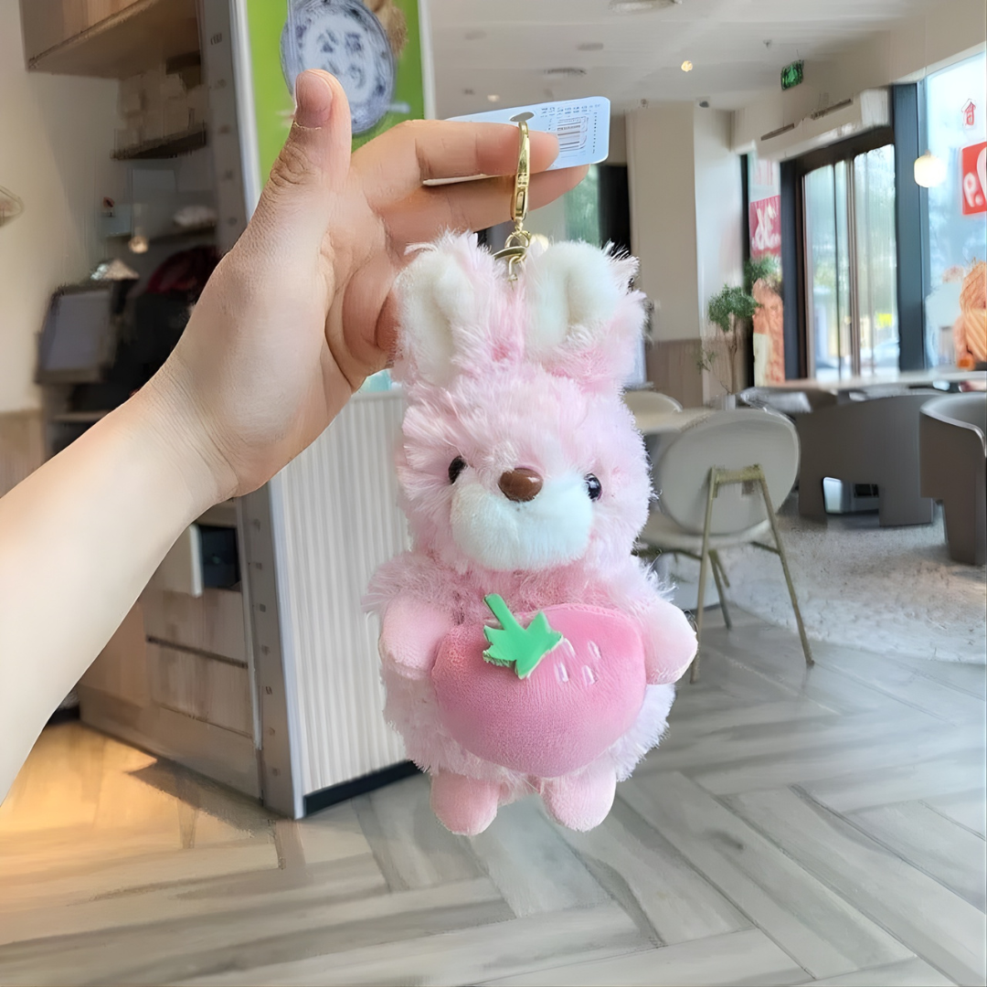 Pink Plush Bunny Keychain Held by a Hand - Tinyminymo