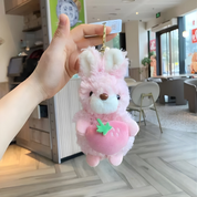 Pink Plush Bunny Keychain Held by a Hand - Tinyminymo