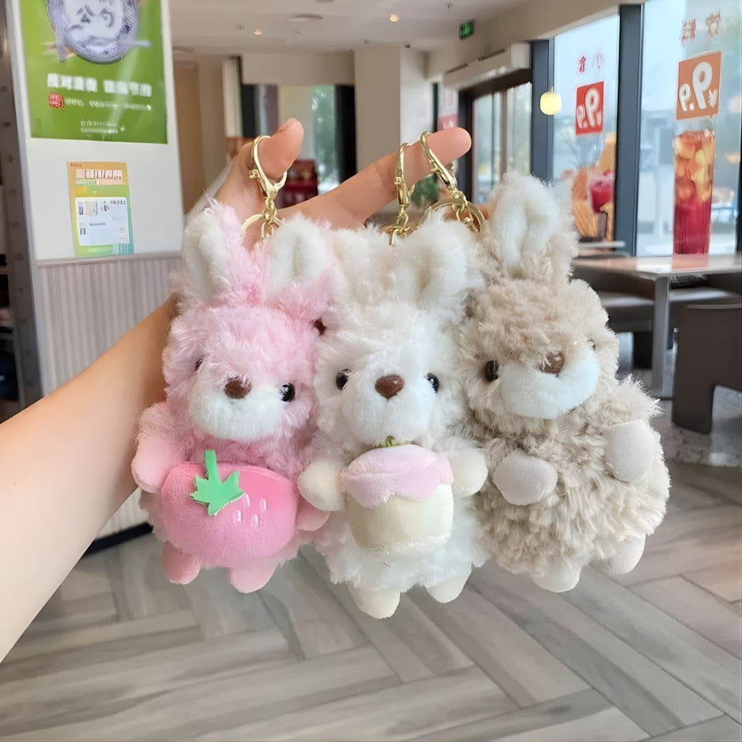 Three Fluffy Bunny Keychains Held by a Hand - Tinyminymo