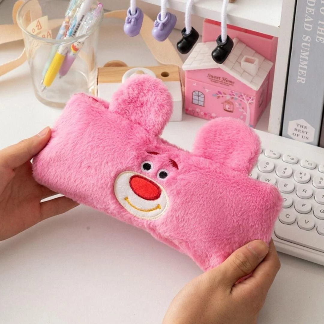 Plush Lotso Bear Zipper Pouch Held in Hands, with a White Keyboard, Toy House, Pens in a Glass and Books in the Background - Tinyminymo