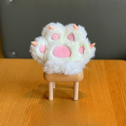 White Plush Paw 3D Keychain Elegantly Displayed on a Wooden Stand Against a Dark Background - Tinyminymo